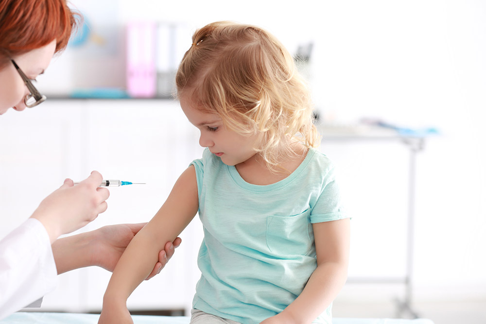 Doctor vaccinates the child